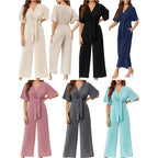 Combinaison femme élégante à jambes larges avec ceinture nouée