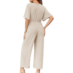 Combinaison femme élégante à jambes larges avec ceinture nouée